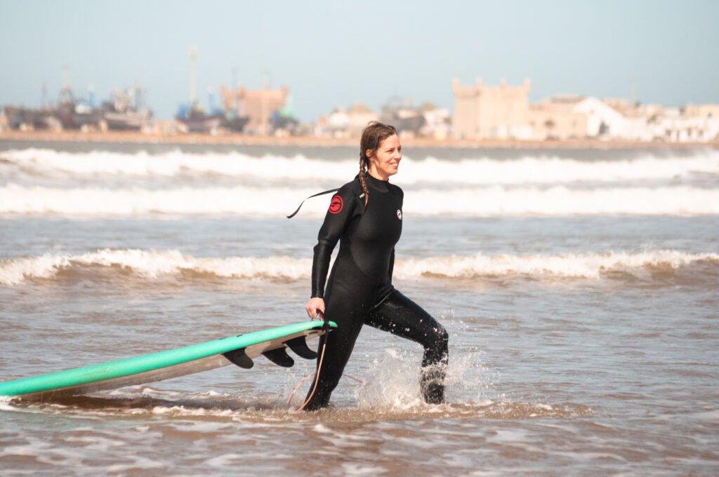 surf student leaving the water in Essaouira, Morocco