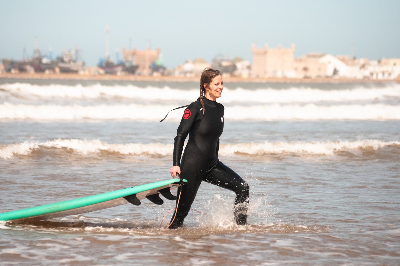 surf student leaving the water in Essaouira, Morocco