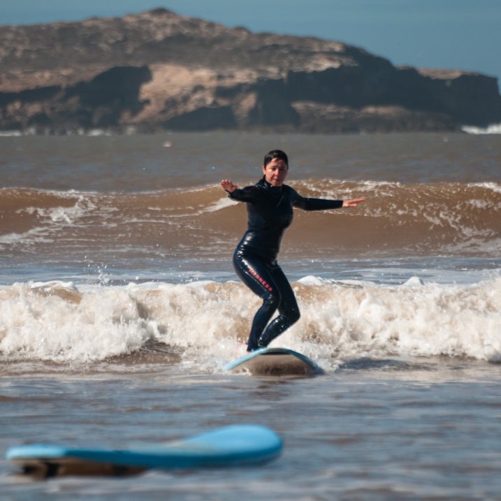Surfer catching the wave in Essaouira, Morocco
