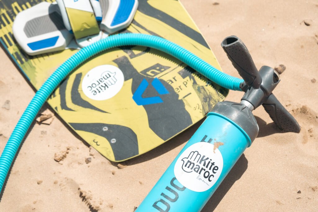 Kite Maroc sticker on kiteboard and kite pump in Essaouira, Morocco