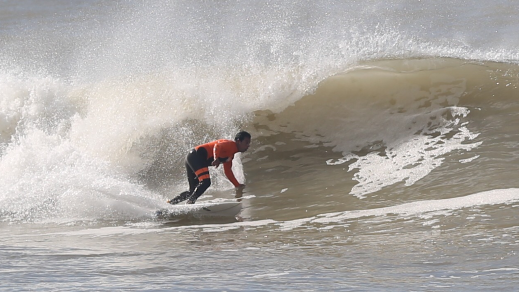 surfer taking a barrel in Morocco