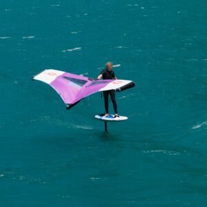 Exciting wingfoil action on turquoise waters, perfect for adventure enthusiasts.